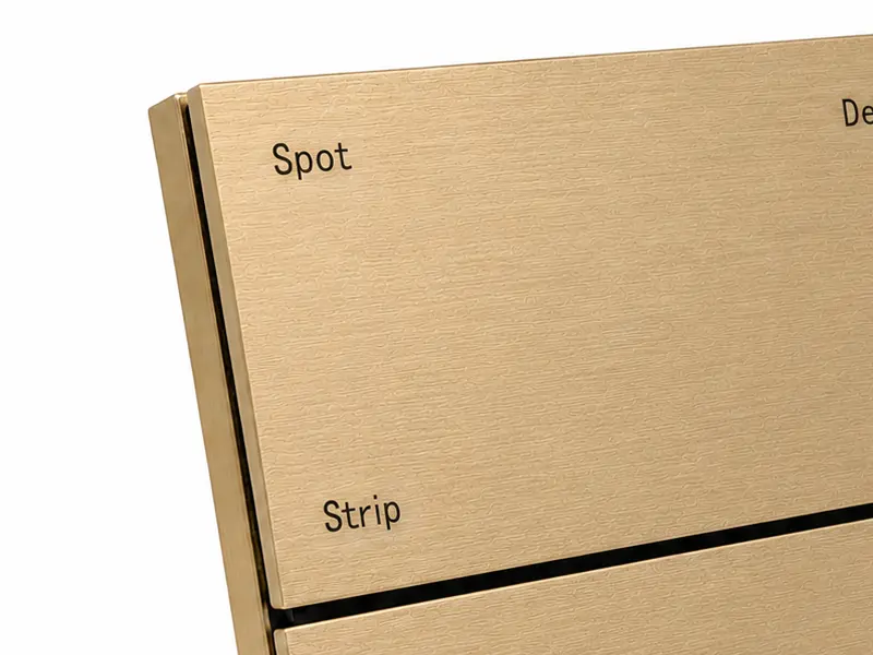 KNX metal smart switch panel in a brushed gold finish